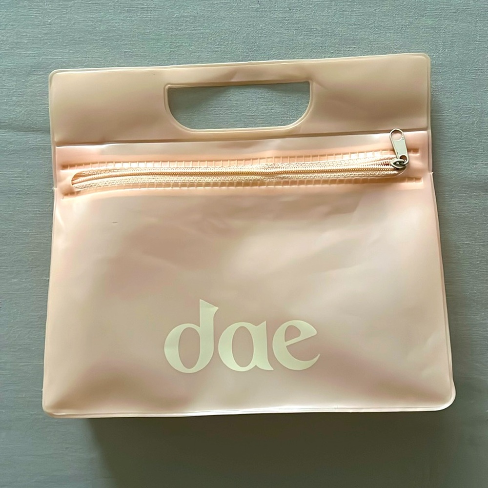 DAE travel bag, beautiful neutral pastel color, zip enclosure and top handle
